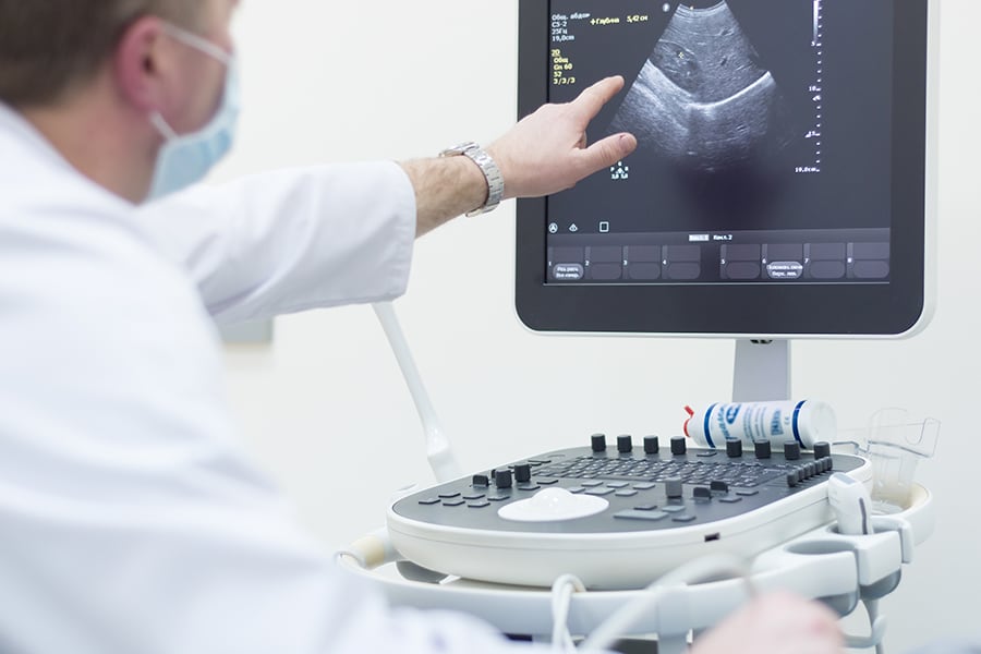 A doctor discussing an ultrasound with a patient