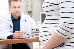 Doctor meets with pregnant patient