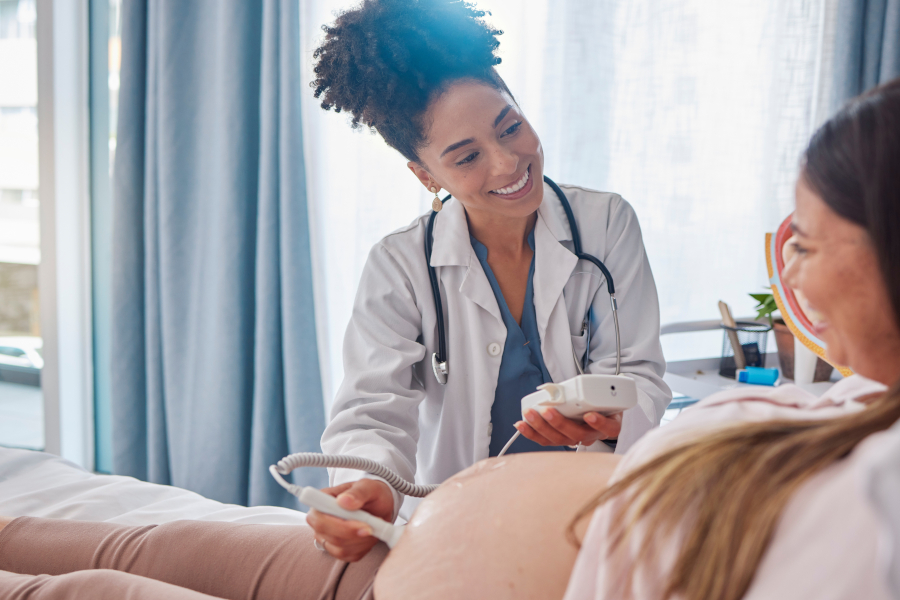 A late in pregnancy woman having a checkup done