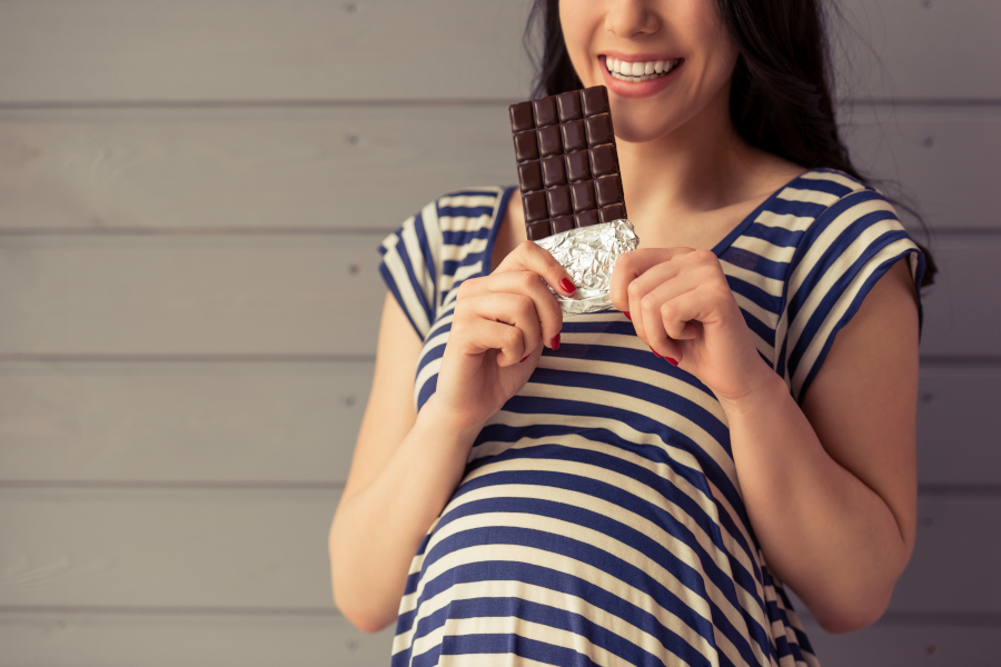 Pregnant woman and chocolate bar
