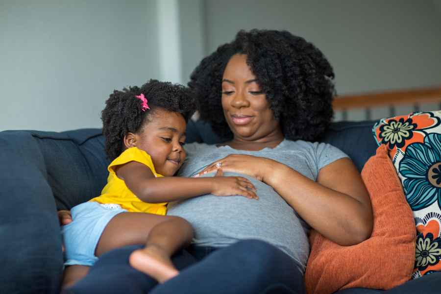 A pregnant woman and her daughter