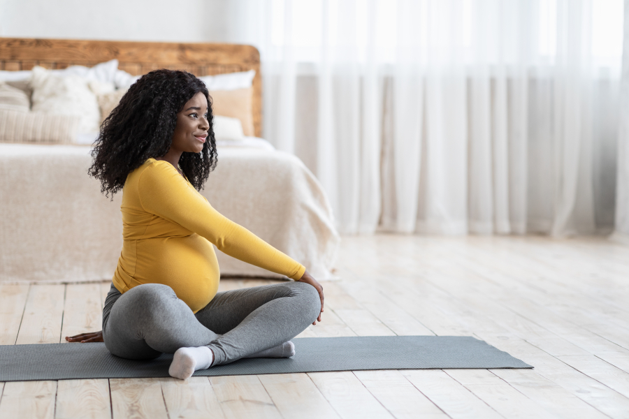 A pregnant woman stretching