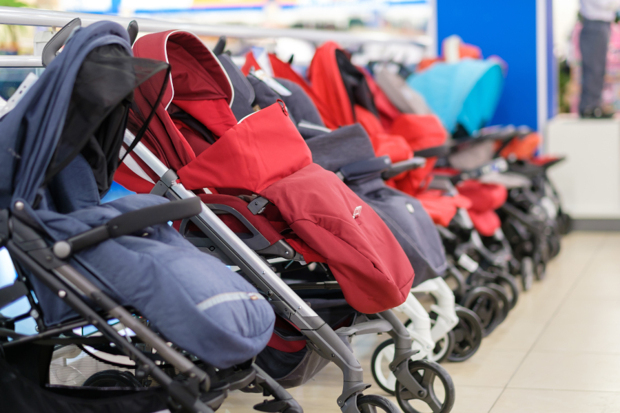 A row of strollers on display