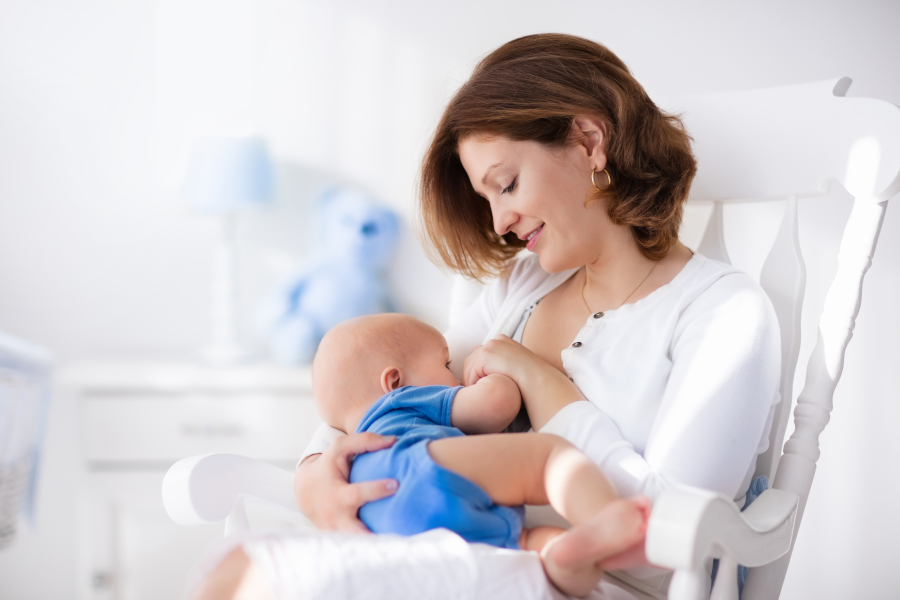 A mother breastfeeds her child