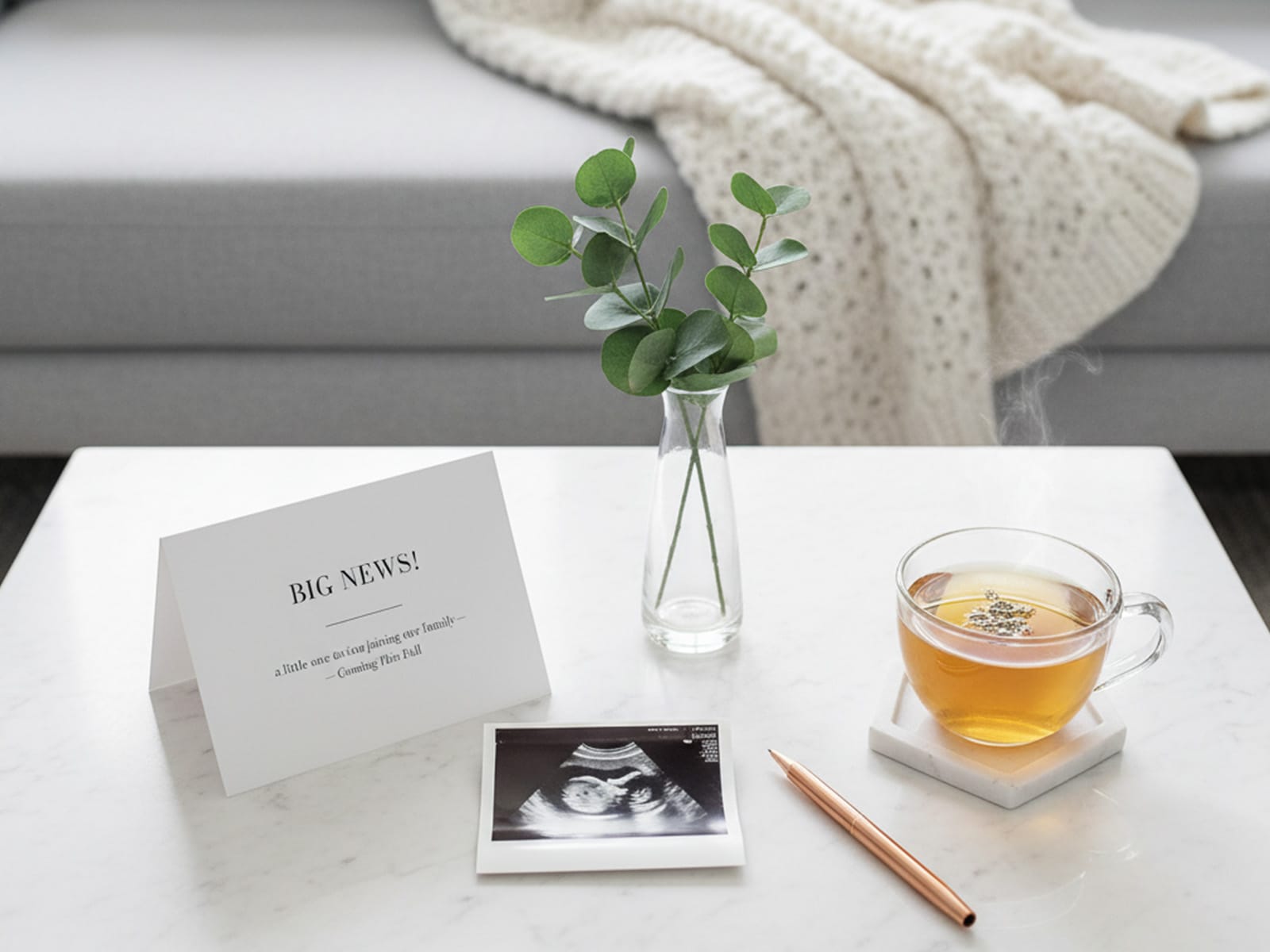 An ultrasound sitting on a table next to a pregnancy announcement